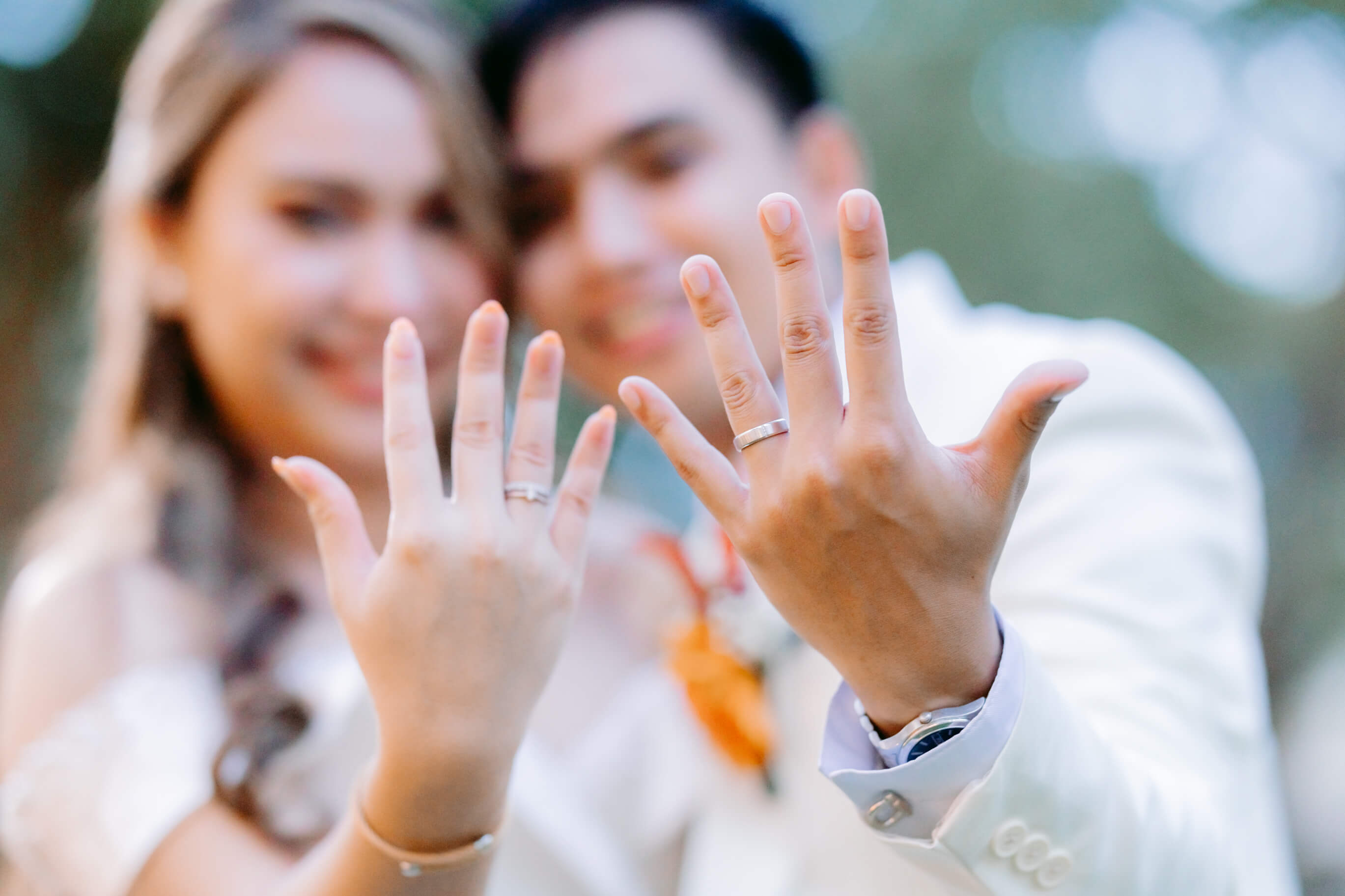 Newlywed Couple showing their rings